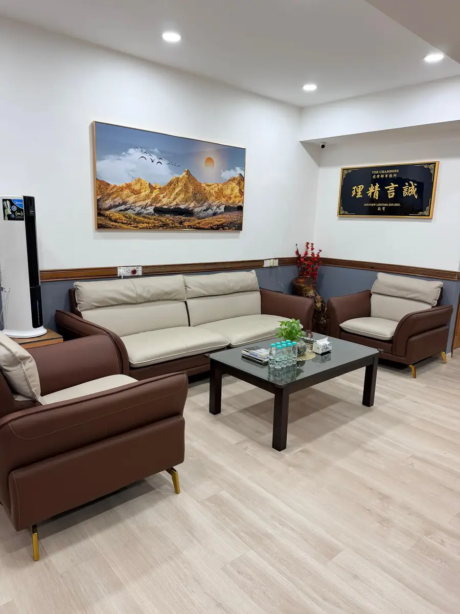 Leather sofas around a low table in the client waiting area