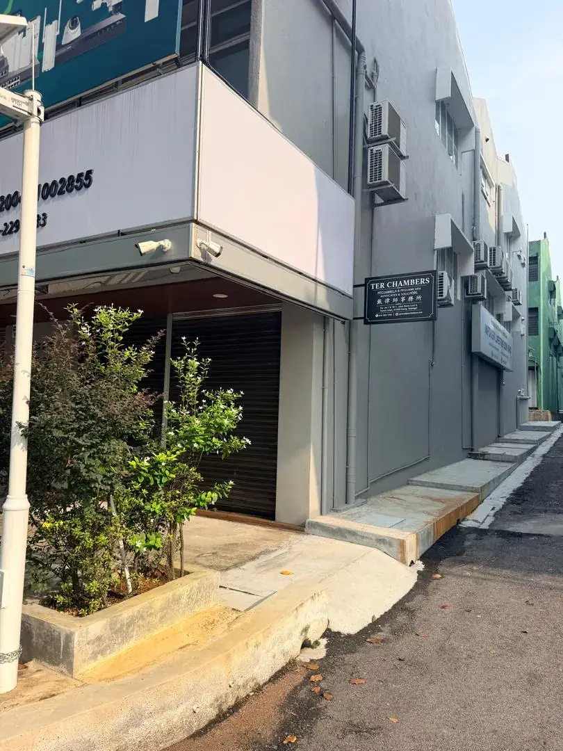 The row of shop lots along Jalan Batai Laut 4, with the firm's blade sign on the building